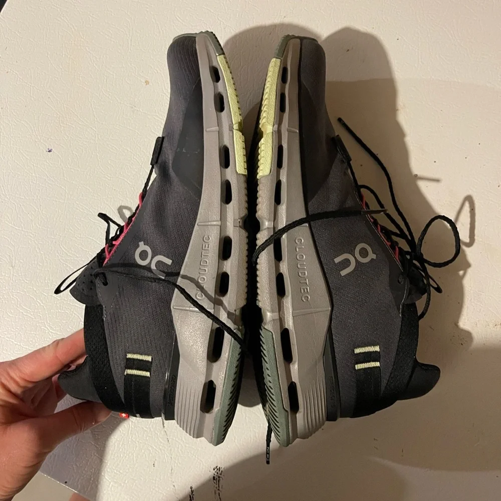 On Running Women’s Athletic Sneakers with Gray Sole and pink and green accents.